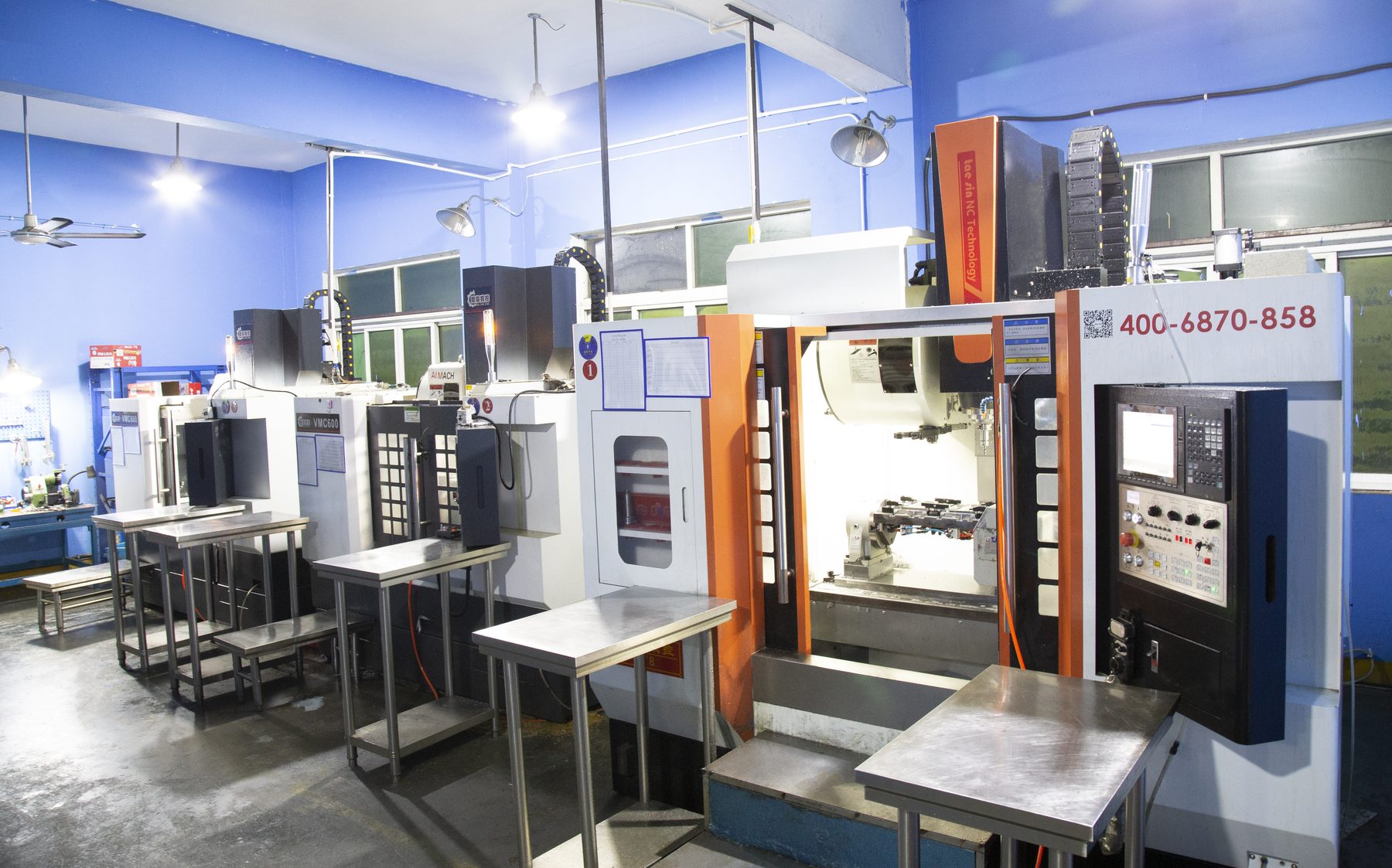 CNC workshop — 16 four-axis machines holding 0.01mm