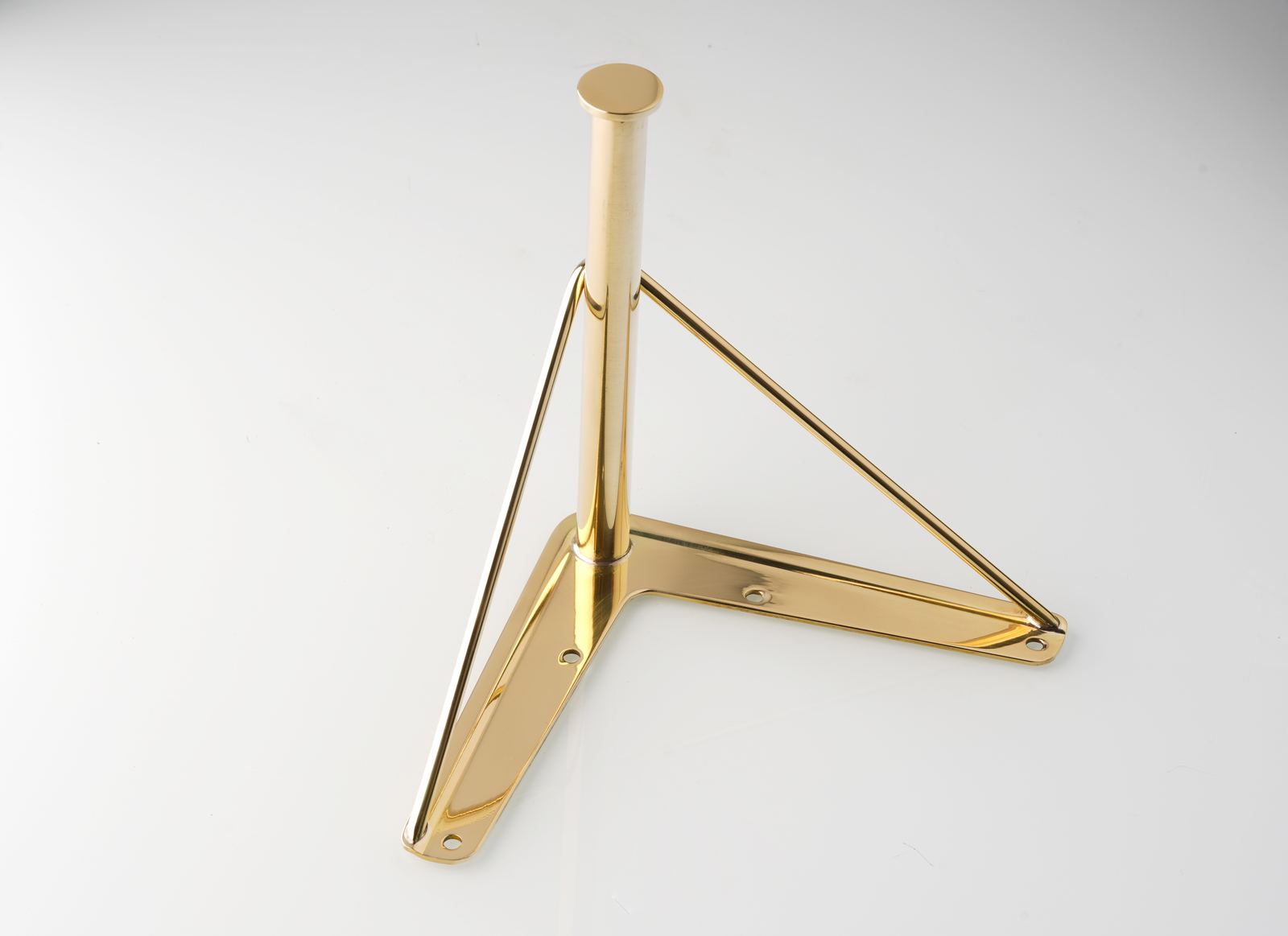 Polished brass furniture leg with mirror finish