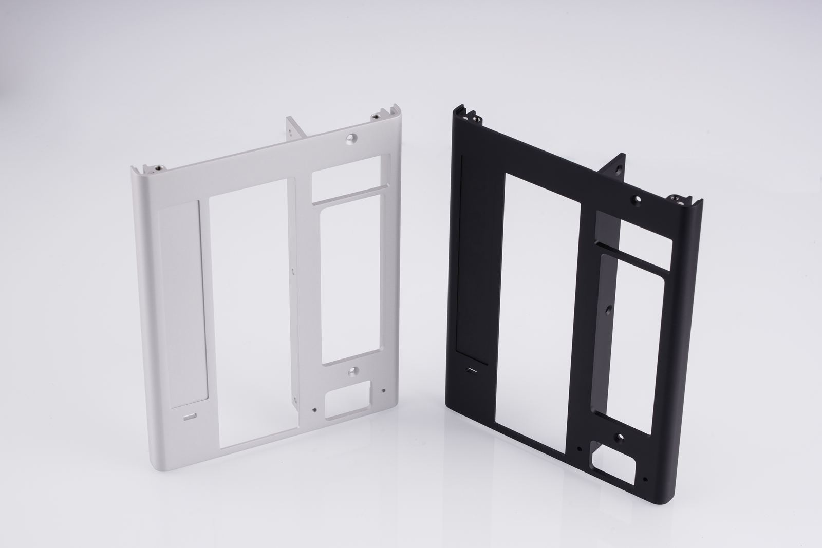 CNC machined aluminium panels held to 0.01mm, silver and black anodized